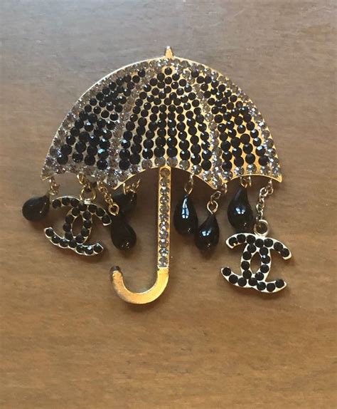 chanel umbrella brooch|real real Chanel brooch.